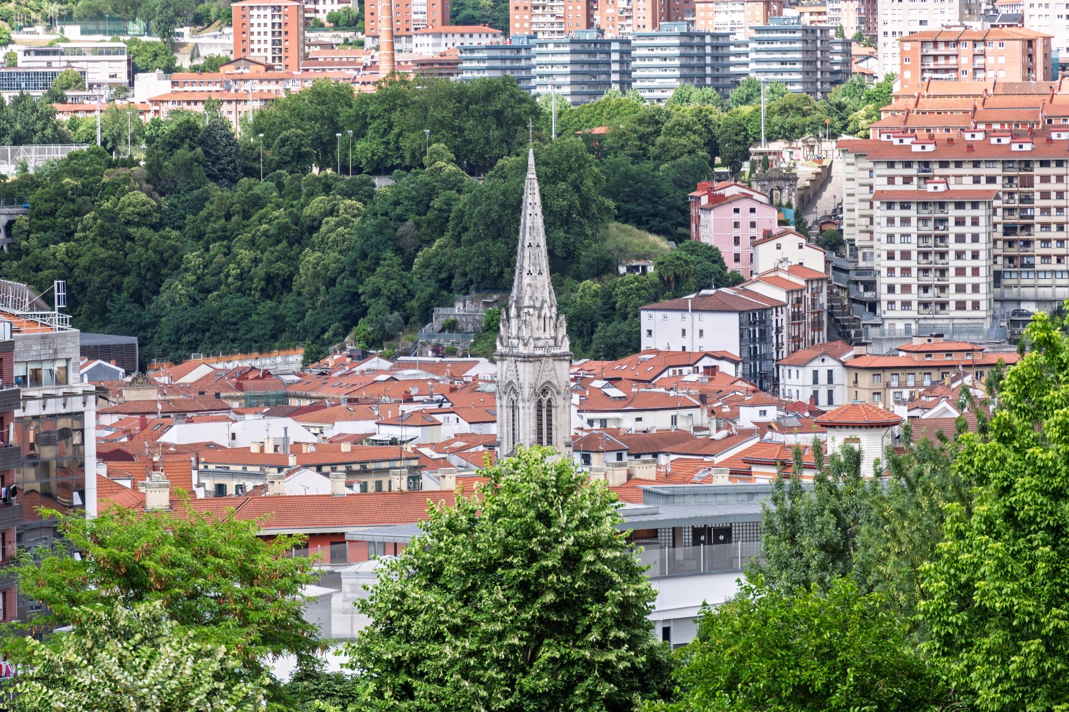 Santiago cathedral spire rising above bilbao cityscape